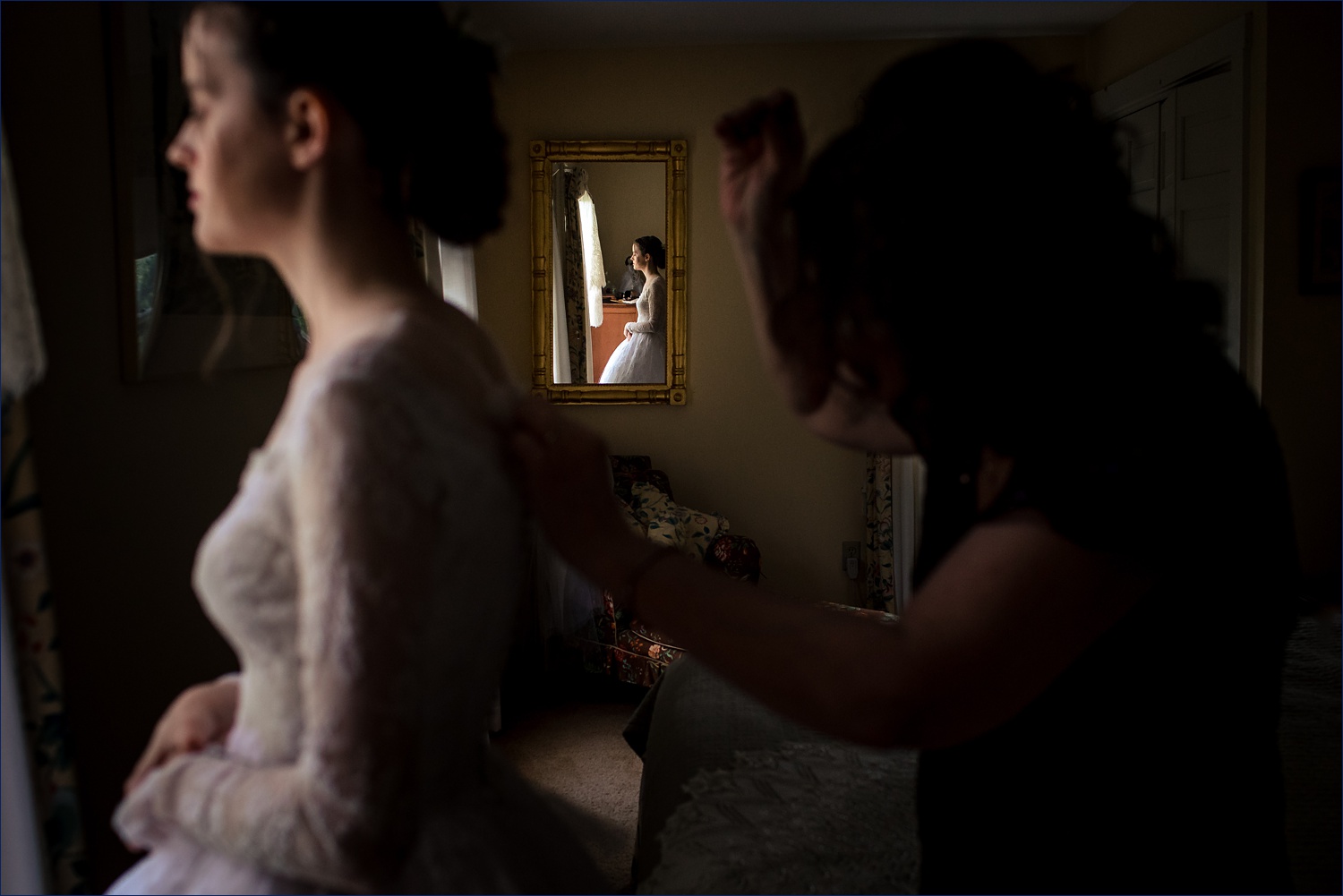 The bride gets into her vintage wedding day gown in NH