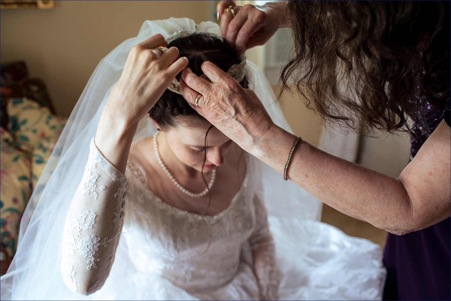 The bride gets her vintage wedding headdress and veil all set