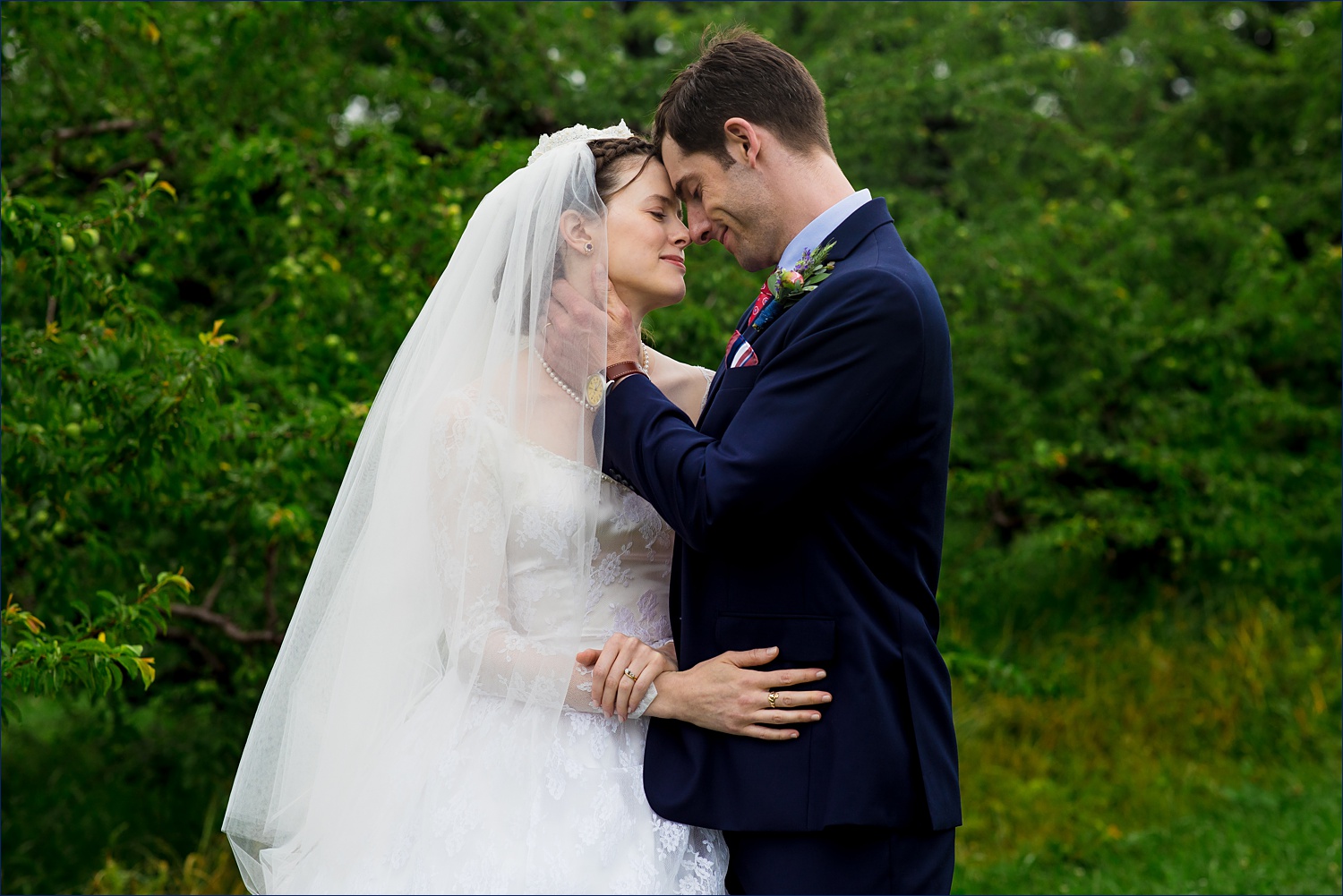 The newlyweds get in close for a loving embrace on their White Mountain NH wedding day