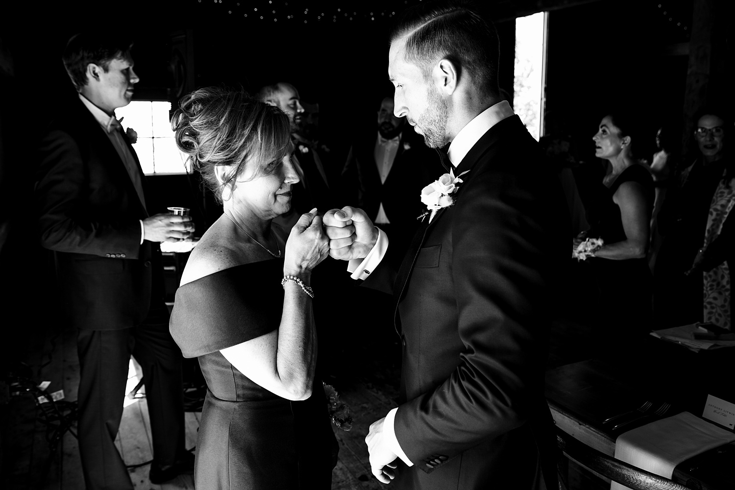 A fist bump between the groom and his mom