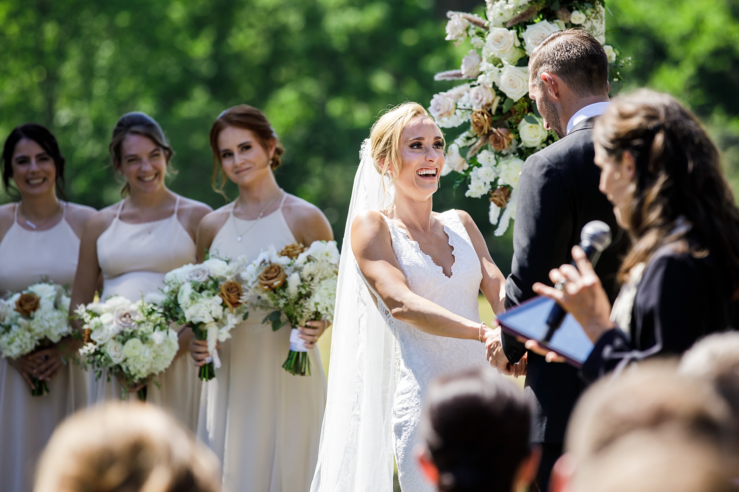 The bride laughs during the wedding ceremony