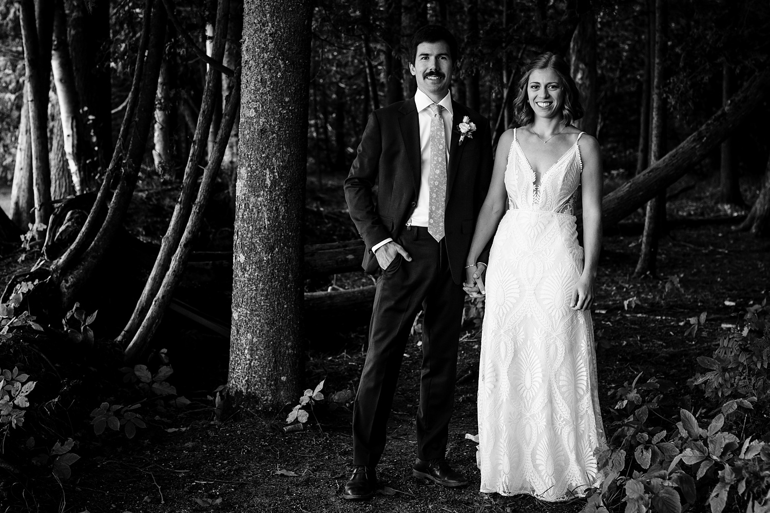 Bride and groom in the woods on their wedding day