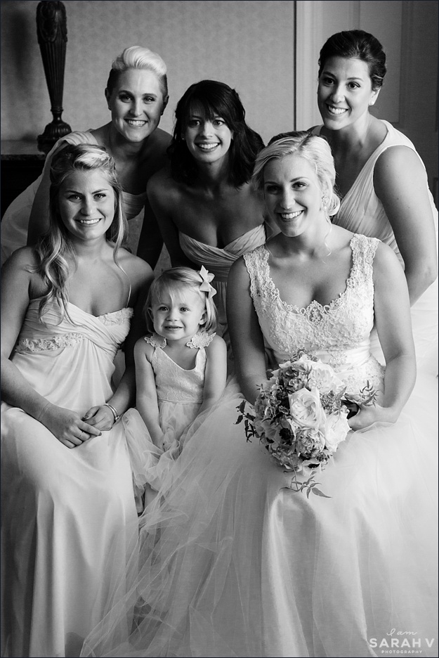The bride gets a picture in with all of her bridesmaids and her flower girl at her downtown Portsmouth hotel
