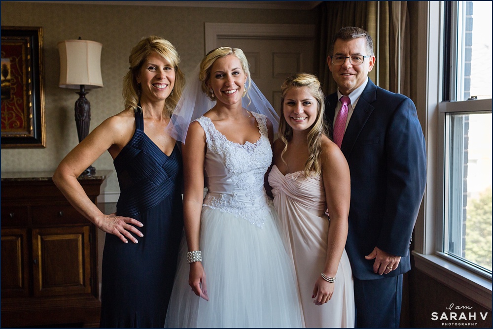 The bride's family takes a quick photo in the Portsmouth hotel room before heading to the ceremony