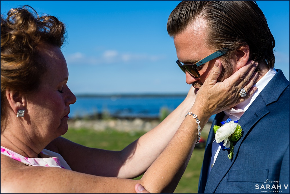 The groom gets some last minute love from his mother before the oceanside ceremony begins
