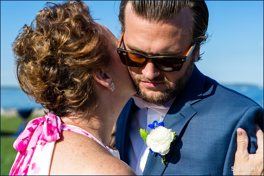 The groom gets a kiss from his mother before the wedding ceremony begins in Rye NH