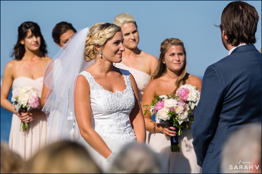 The bride smiles at her groom during the wedding ceremony at the Seacoast Science Center