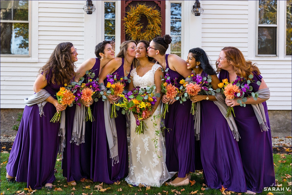 The bridesmaids show some love to the bride during pictures in Southern Maine wedding