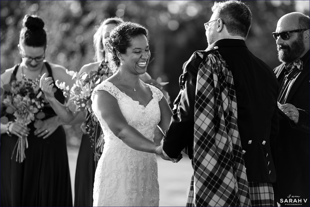 William Allen Farm wedding with the bride laughs during the outdoor fall ceremony