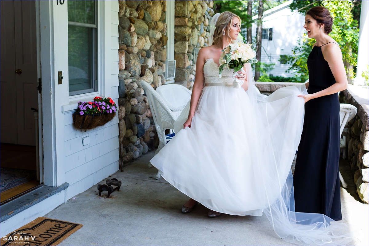 The bride and her maid of honor gather their flowers to leave for the ceremony