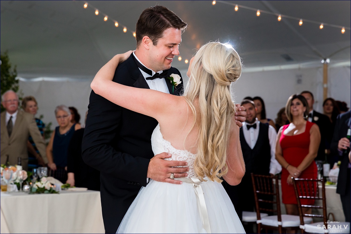 The bride and groom dance their first dance under the tent in Maine