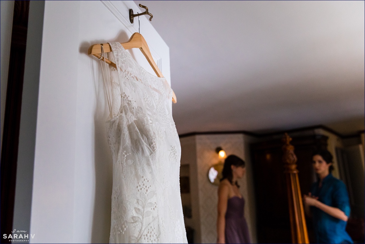 The bride's wedding dress hangs on a door at the Ivy Manor Inn in Bar Harbor