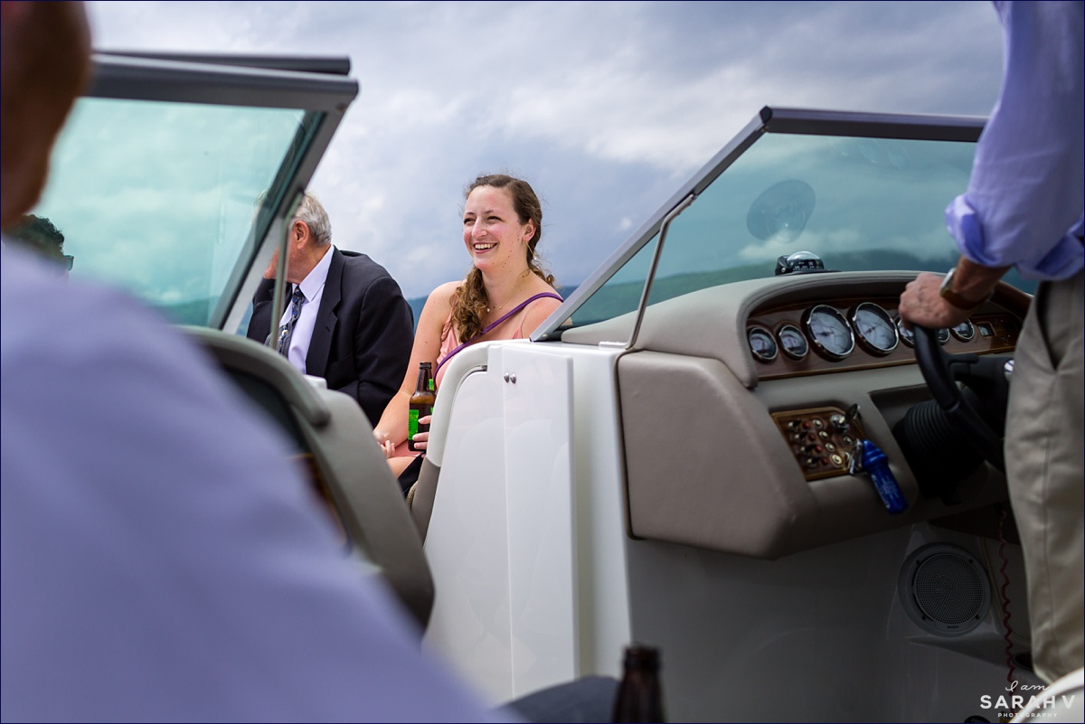 Guests ride boats over to the island for the ceremony with a storm on their heels in NH