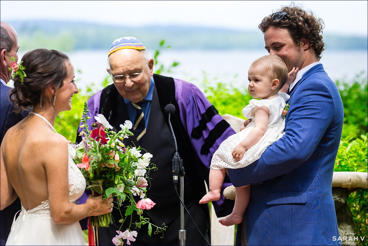 Before the wedding ceremony starts, the couple has their daughter baptized on Church Island like her father was when he was little
