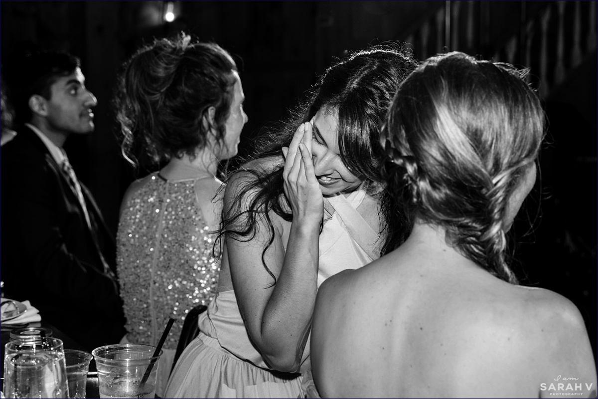 Bridesmaid tears up after her speech to the newlyweds in the Barn at the couple's camp wedding in NH
