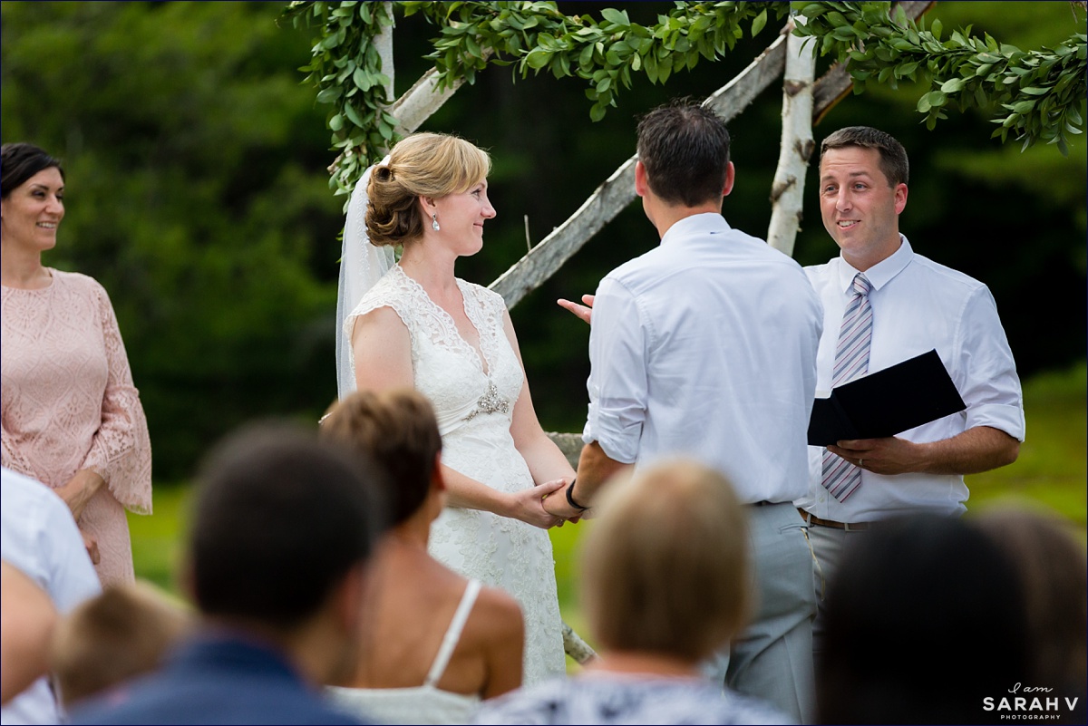 The Preserve New Hampshire Wedding Photographer NH Mt. Chocorua in Tamworth Lake Woods Greenery Ceremony on the lawn bride groom