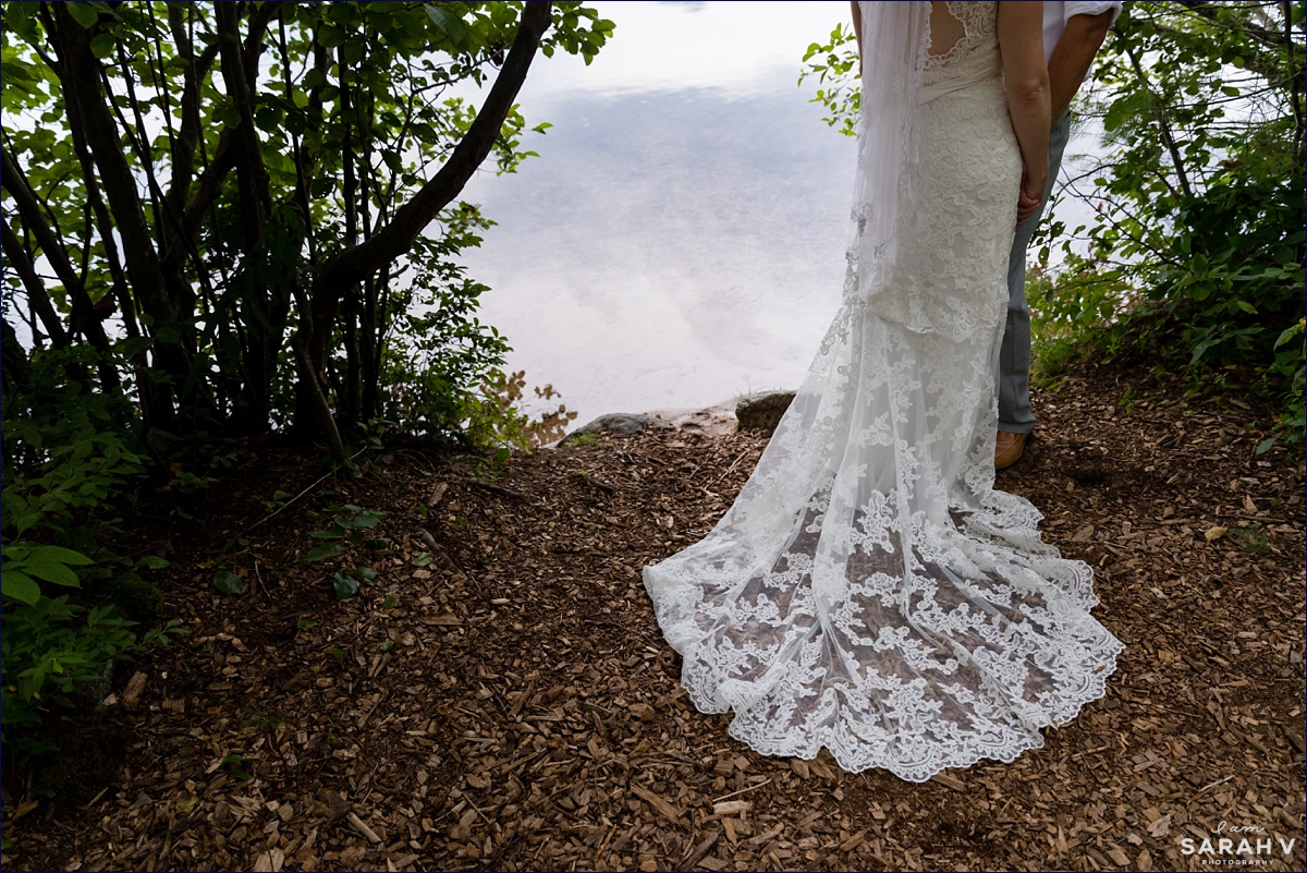 The Preserve New Hampshire Wedding Photographer NH Mt. Chocorua in Tamworth Lake Woods Greenery Bride and Groom at the Lake with the Mountains wedding gown