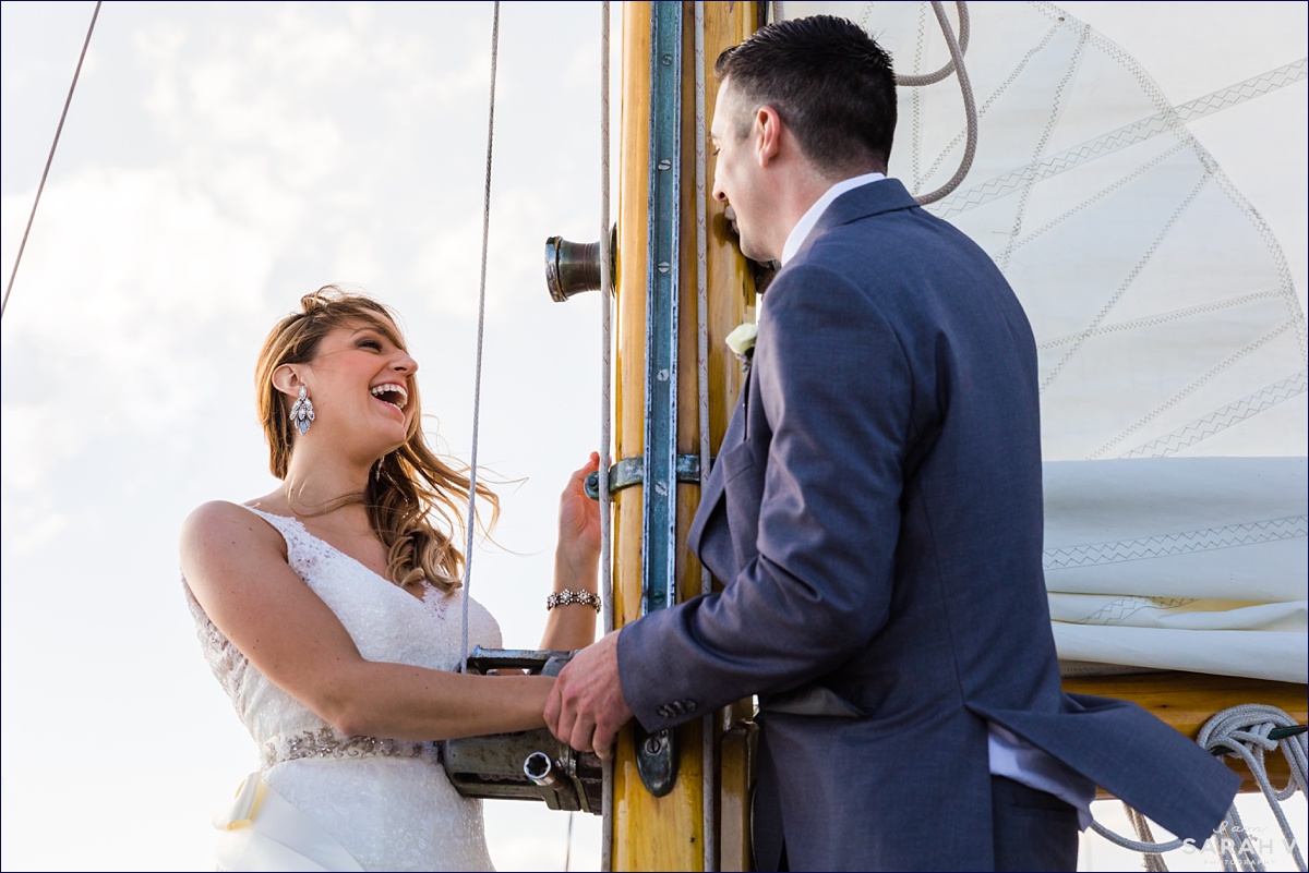 Silverlining Sailing Sailboat Elopement the couple stands to say their vows to one another out in the ocean
