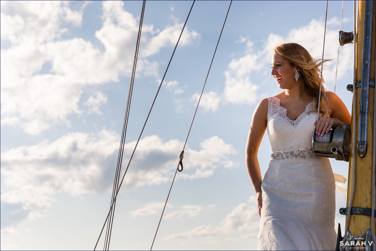 Silverlining Sailing Sailboat Elopement the bride stands tall aboard the boat after she had her wedding on the ocean