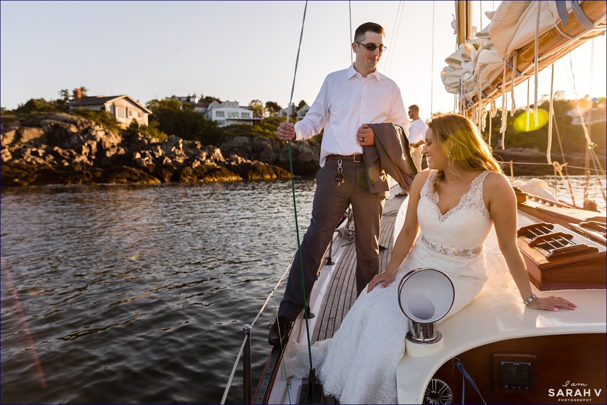 Silverlining Sailing Sailboat Elopement the couple are on the boat in Perkin's Cove as the sun is setting on their wedding day in Maine