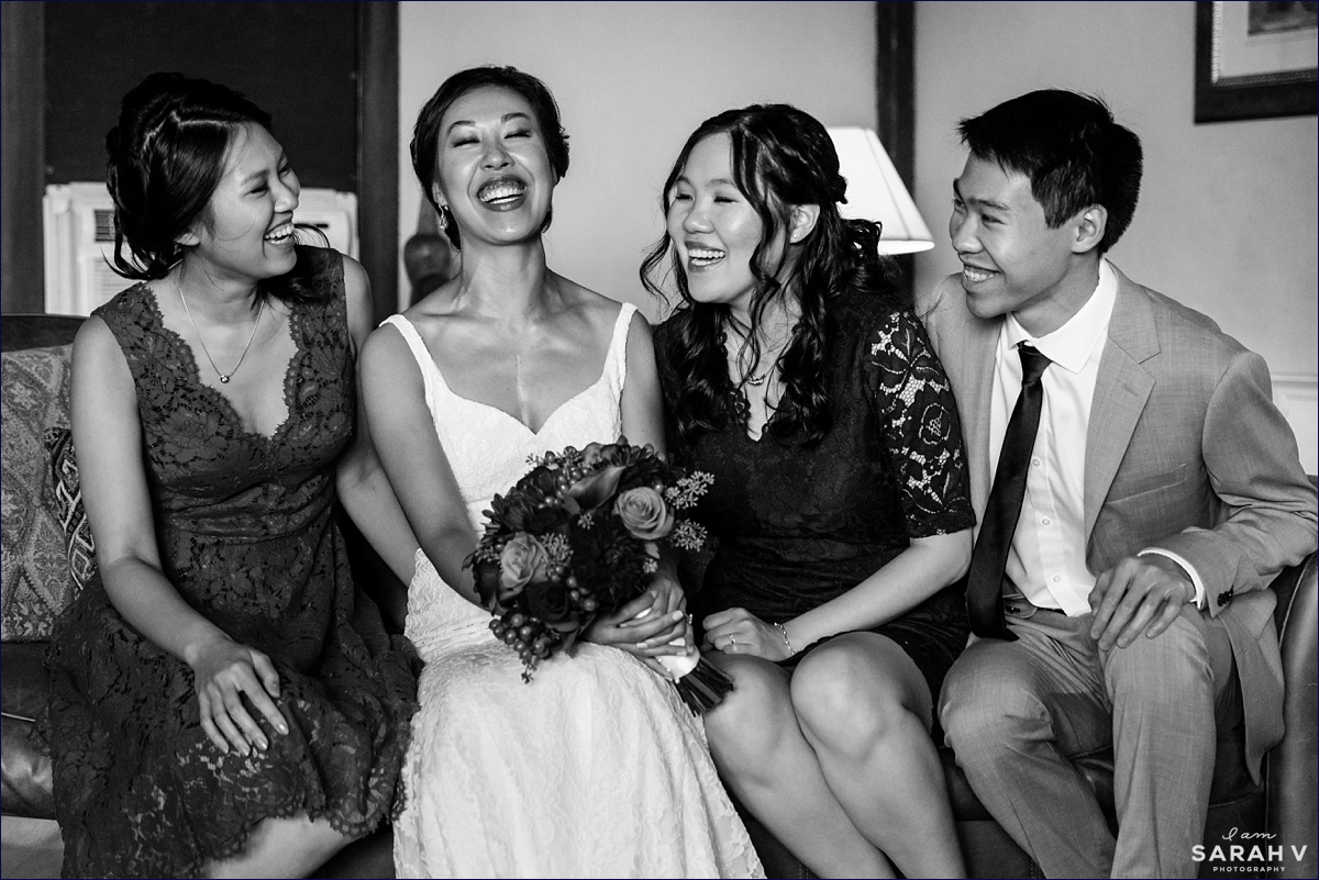 The bride and her siblings laugh with one another at the Crane Estate wedding venue in MA