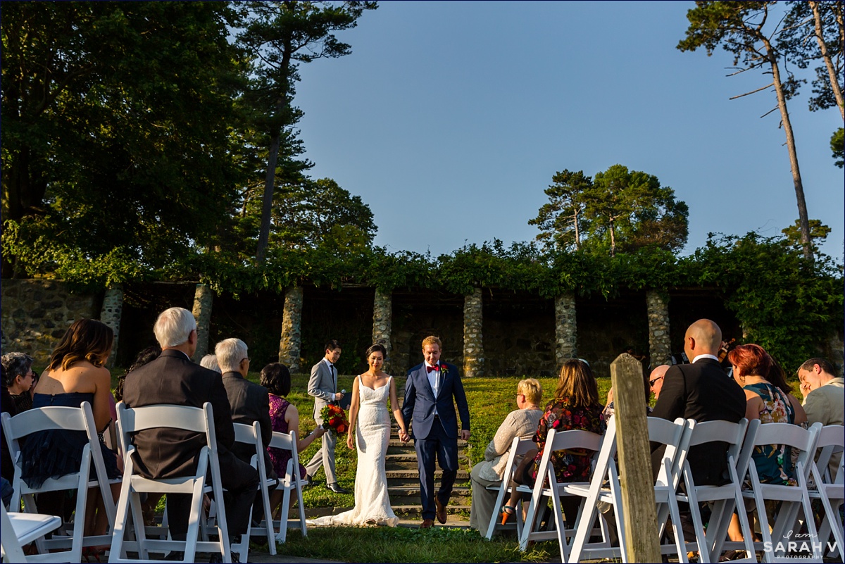 The bride and groom are officially married at their sunny fall outdoor wedding