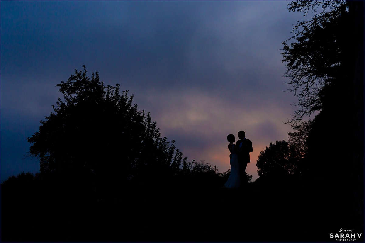 Crane Estate wedding with the couple dancing with one another in front of the sunset sky