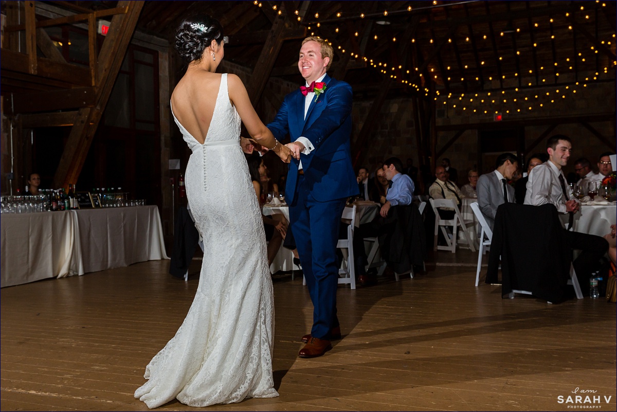 The Barn at Crane Estate wedding reception with the groom giving the bride a spin during their first dance