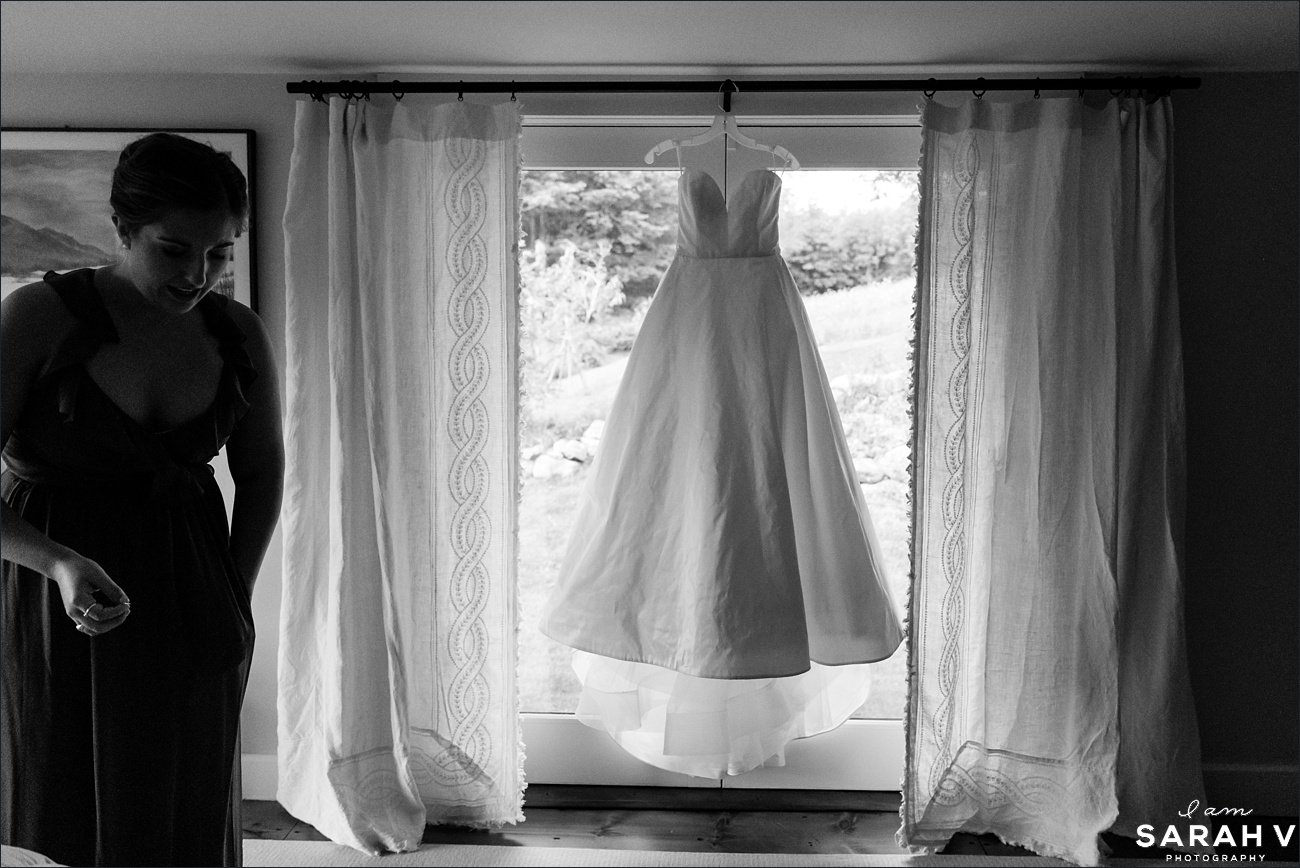 The bride's dress is hung in her room awaiting to be put on