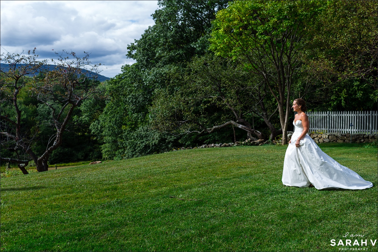 The bride walks to her first look on the front lawn of her family's farmhouse with views of Mount Monadnock New Hampshire