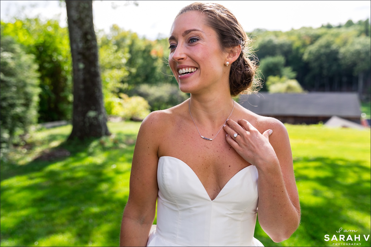 The bride stands on the front lawn which overlooks Mount Monadnock New Hampshire