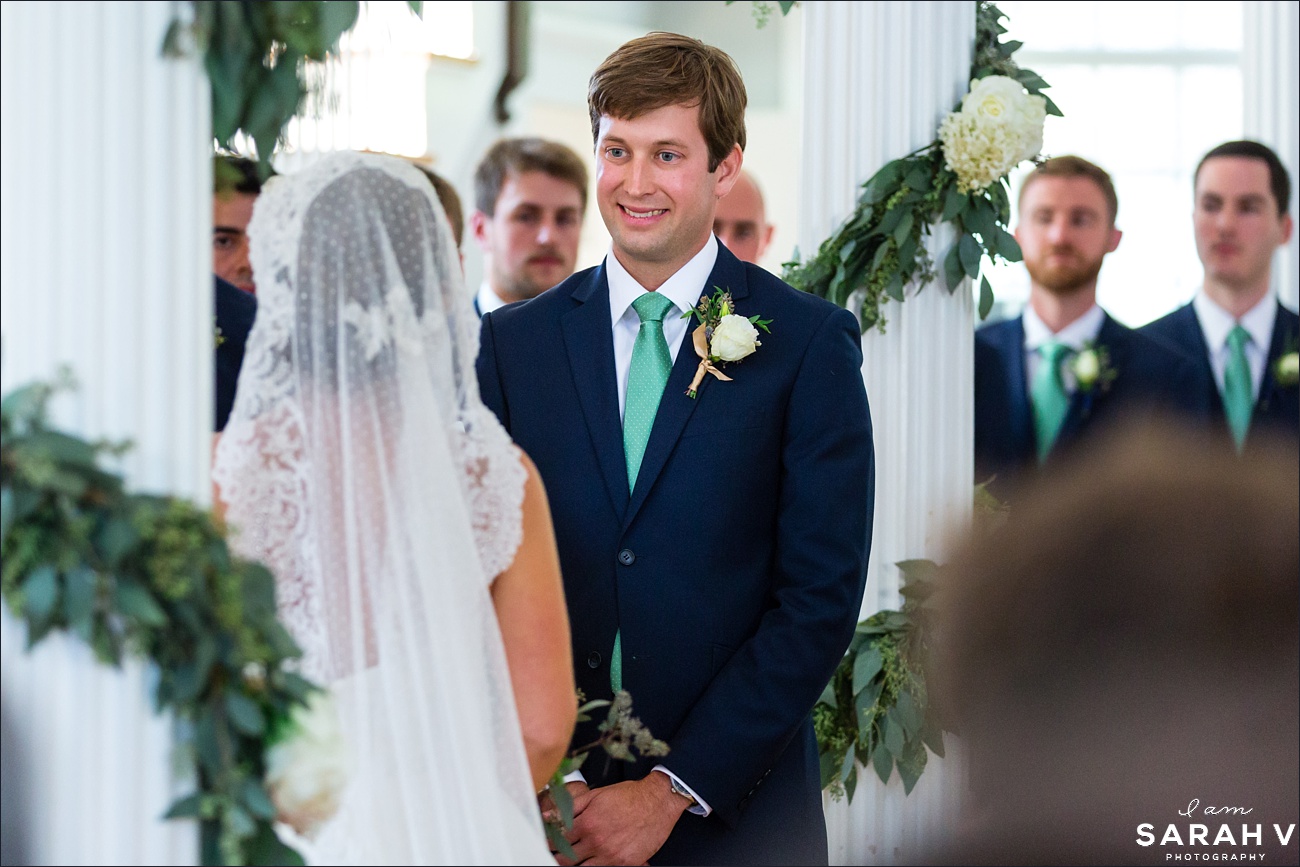 The groom smiles at his bride in their Jaffrey Meetinghouse NH wedding ceremony