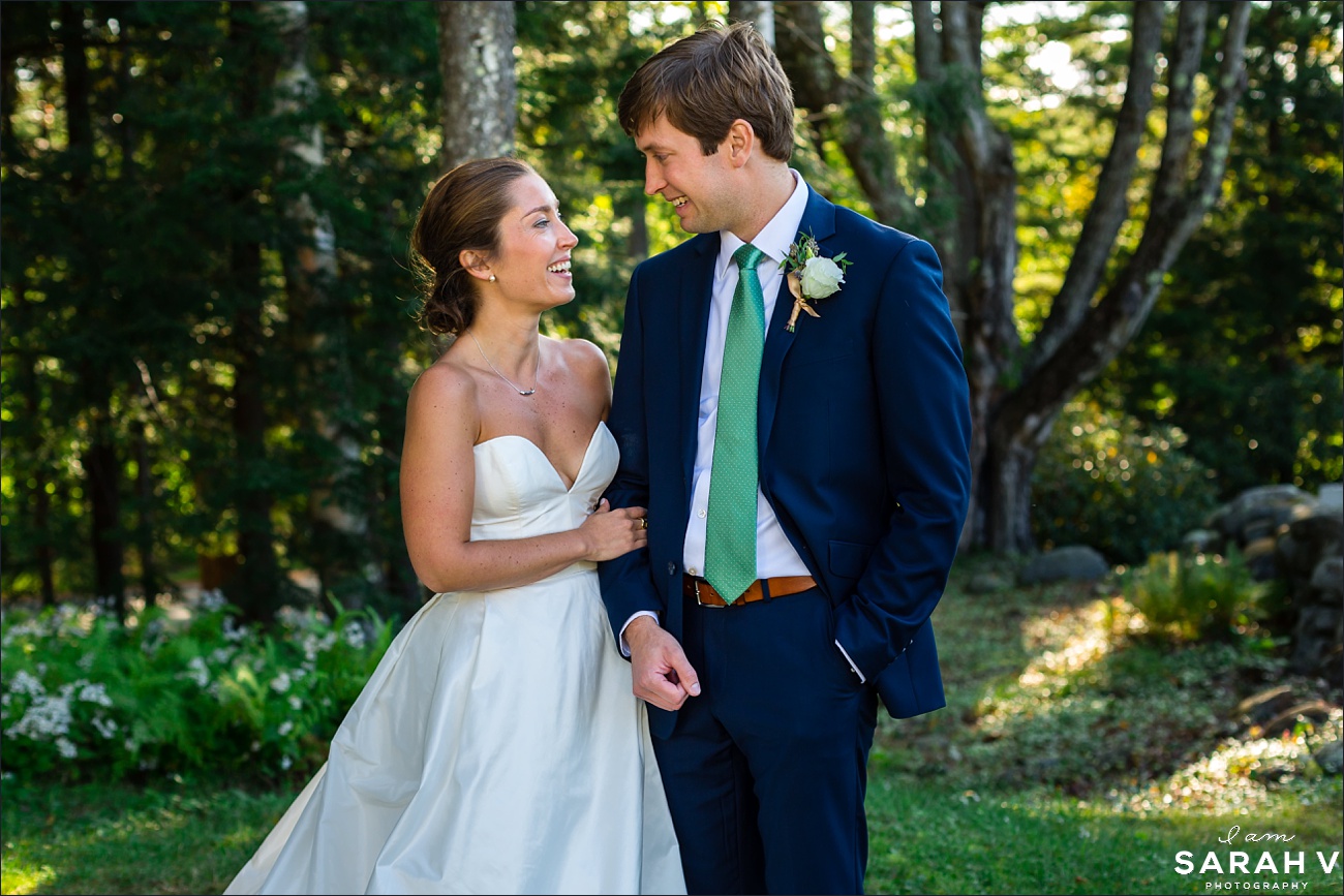 New Hampshire Wedding Photographer Jaffrey Meetinghouse the bride and groom smile at each other after their summer wedding in the mountains