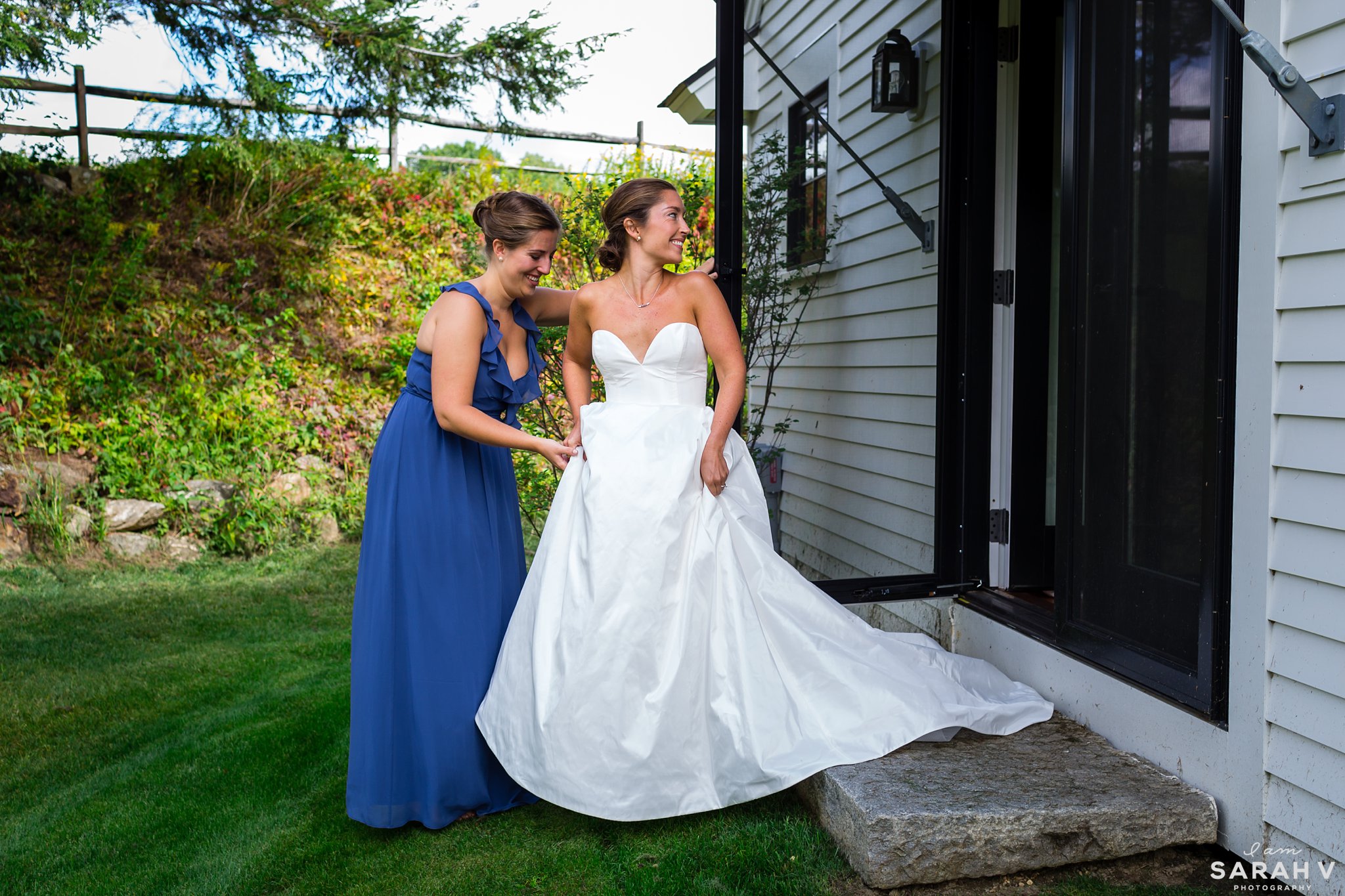 The bride heads to her first look with help from her sister