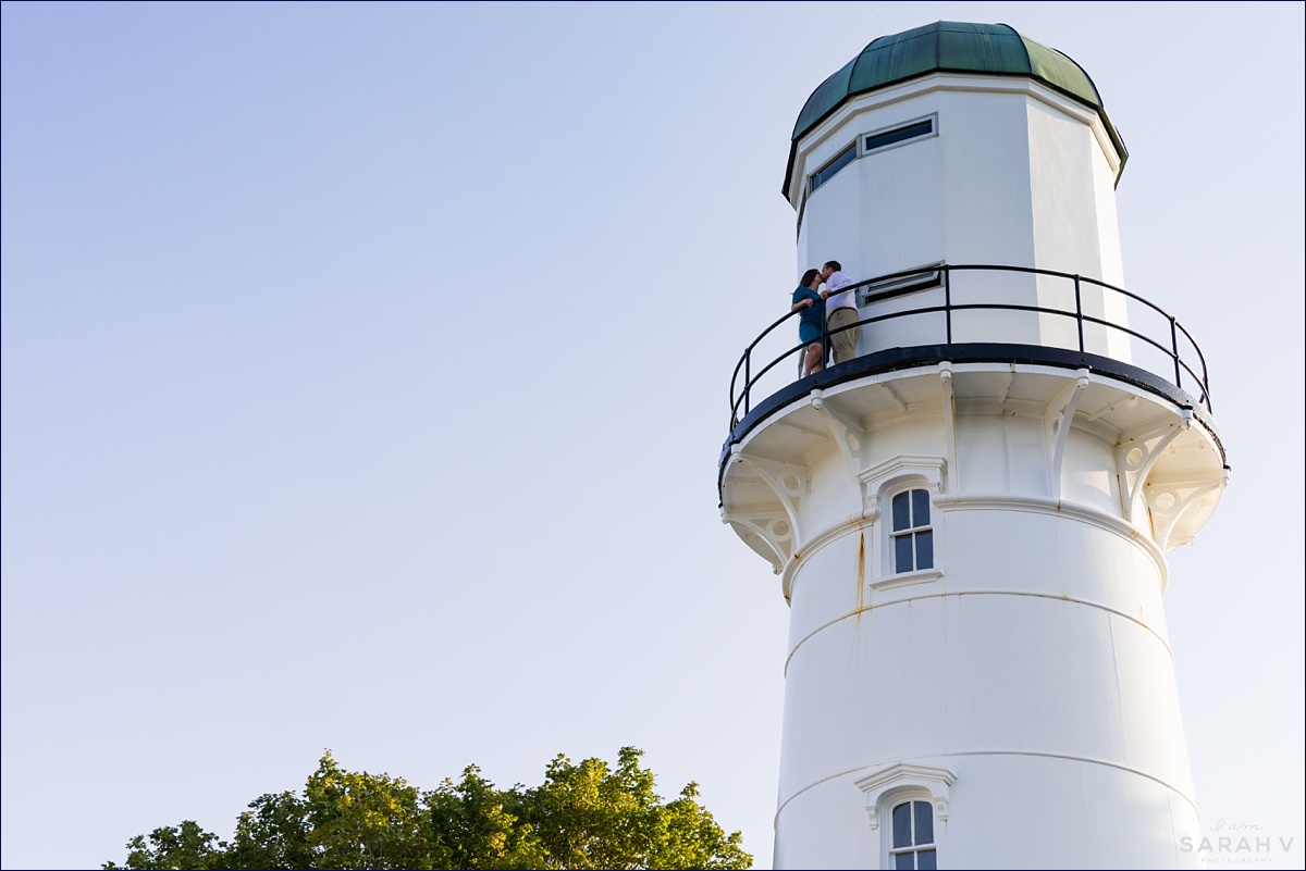 Cape Elizabeth Maine engagement session with the couple at the top of a lighthouse kissing