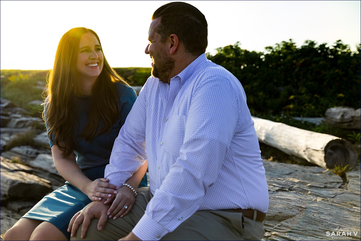 Kettle Cove Maine Wedding Photographers Engagement Session Portland Cape Elizabeth with the couple backlit by the bright sun on the water