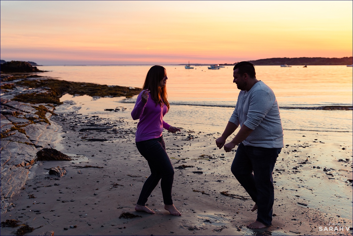 Kettle Cove Maine Wedding Photographers Engagement Session Portland Cape Elizabeth the engaged couple dance down by the water's edge