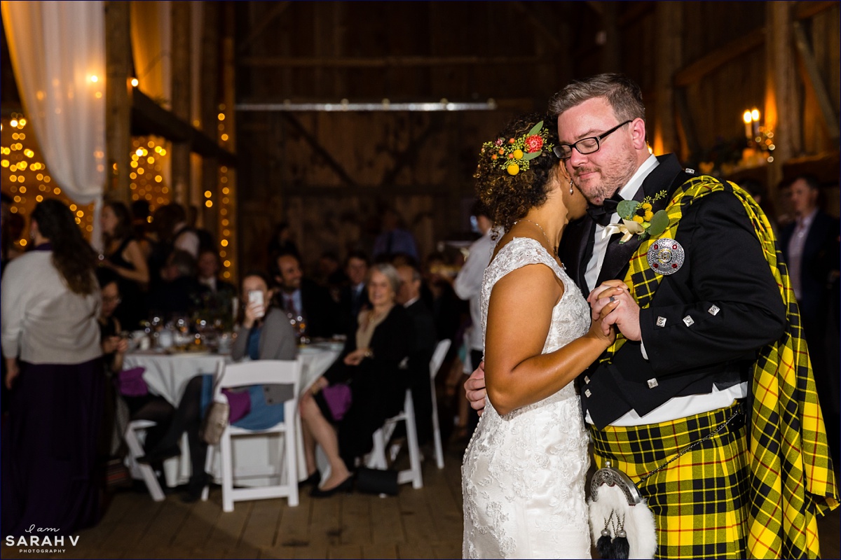 William Allen Farm wedding the bride and groom have their first dance while he is in his custom kilt in their barn reception