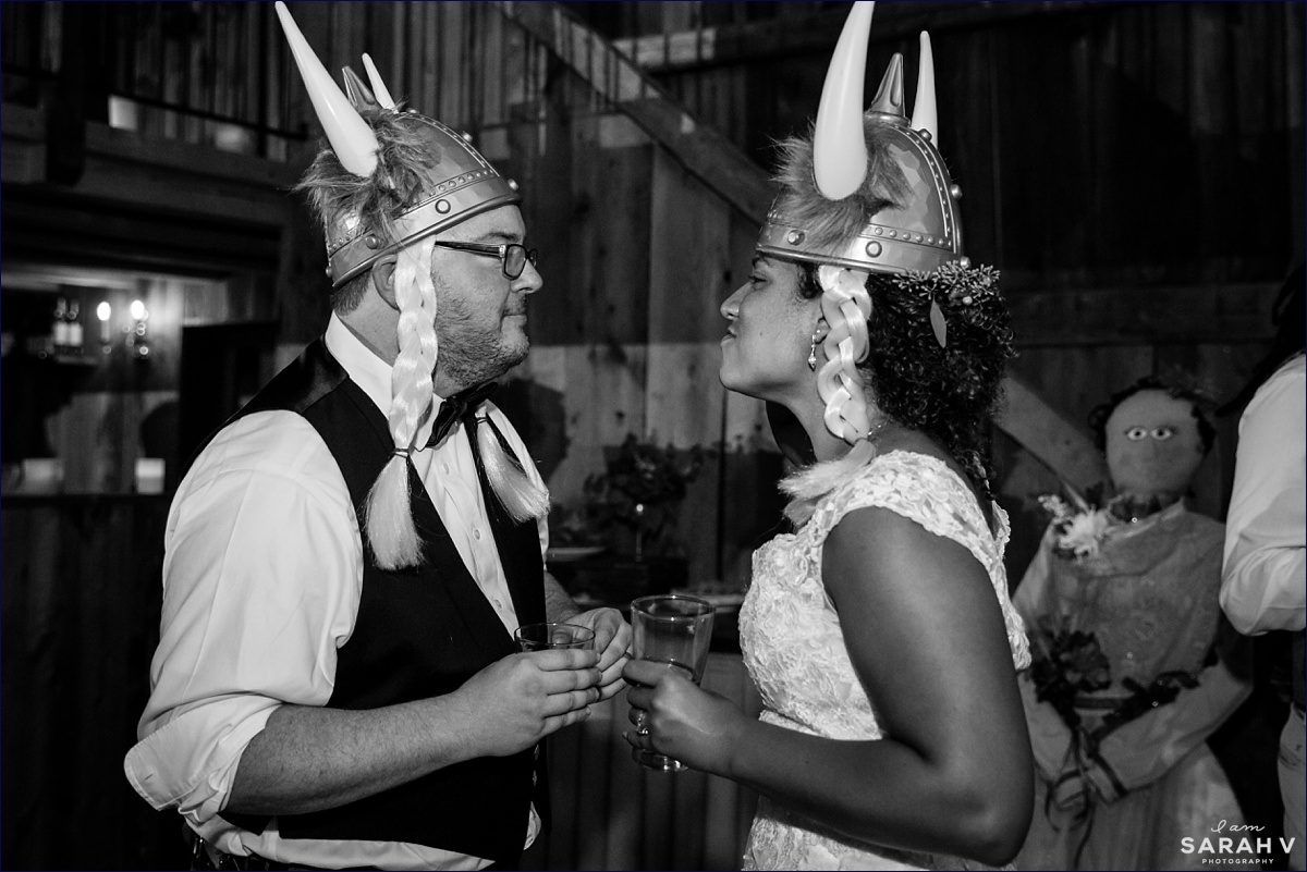 William Allen Farm wedding reception in the barn the bride and groom wear viking hats on the barn dance floor