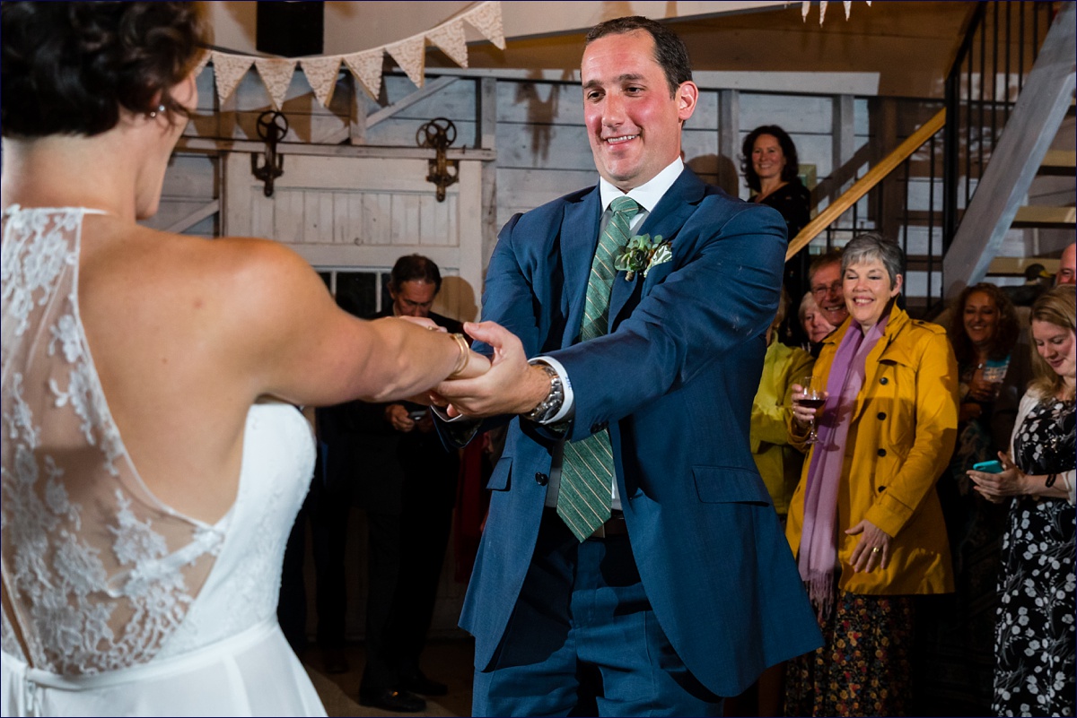 Hardy Farm bride and groom have a lively first dance at their wedding reception in the barn