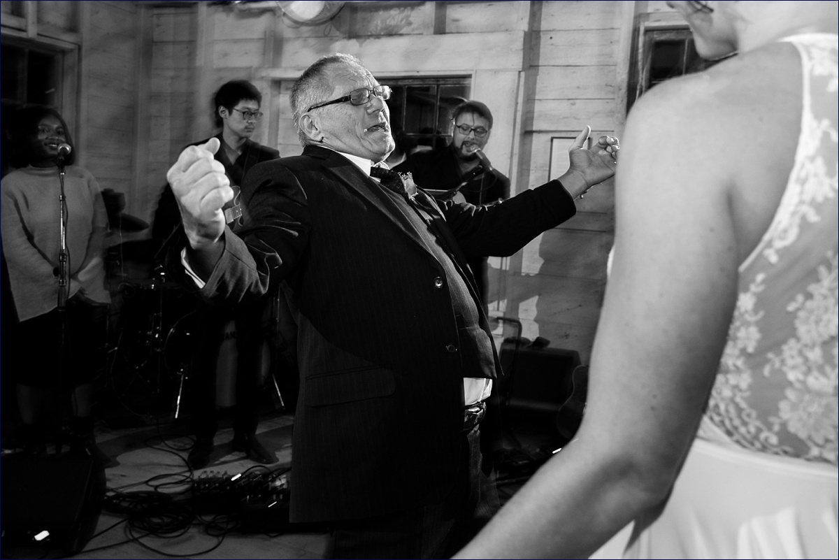 Father of the bride dances during the lively wedding reception