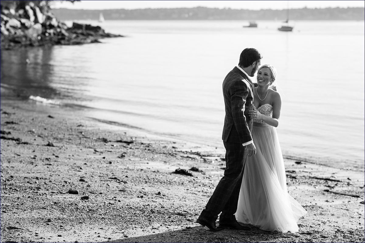 Maine Peaks Island bride and groom playing on the beach together