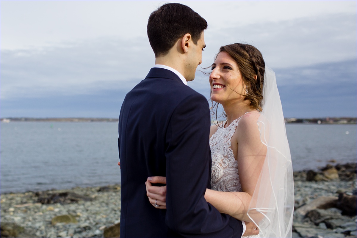 Portland Maine Wedding Photographer the bride and groom smile and take in the moments on their wedding day at the Eastern Promenade