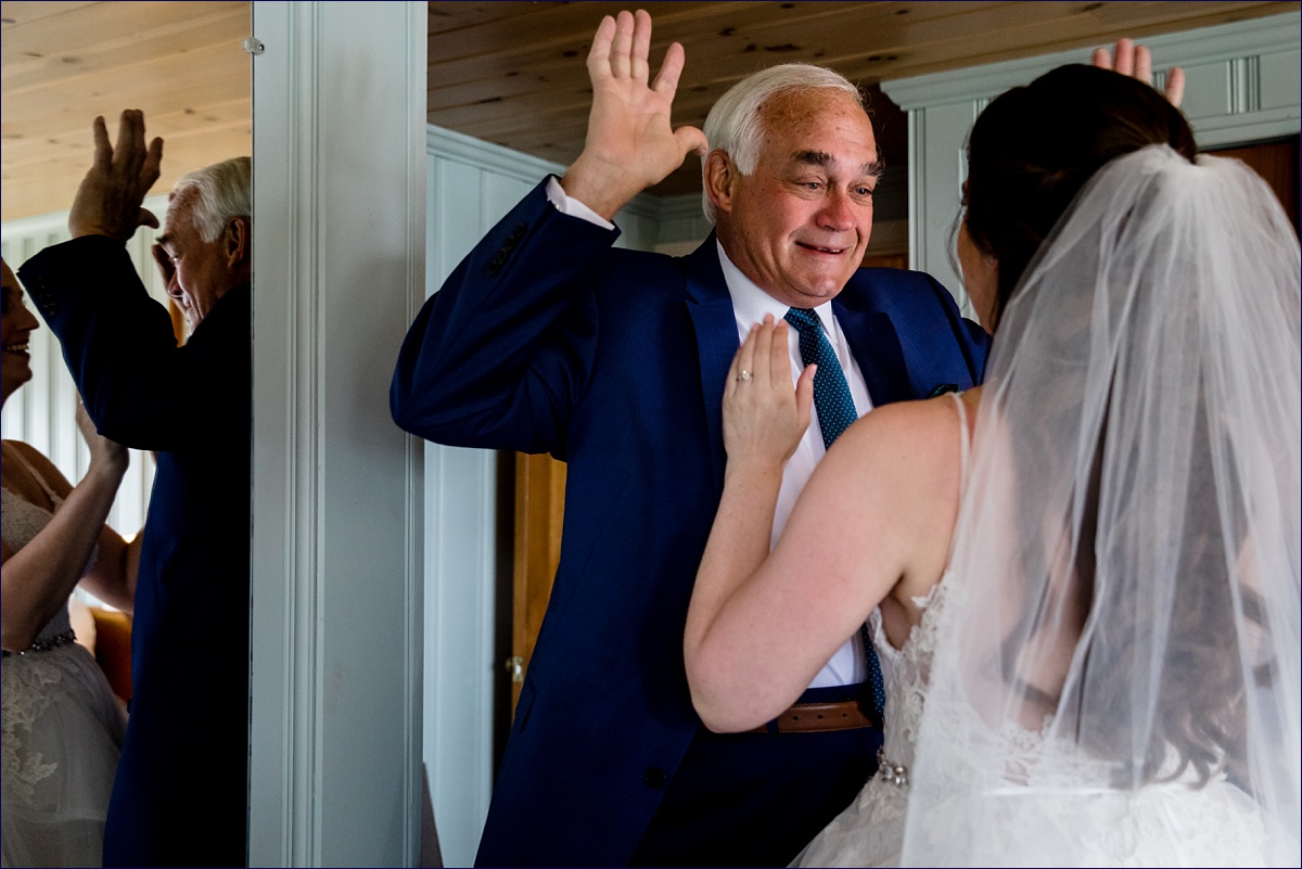 The father of the bride reacts to seeing his daughter all dressed up on her wedding day
