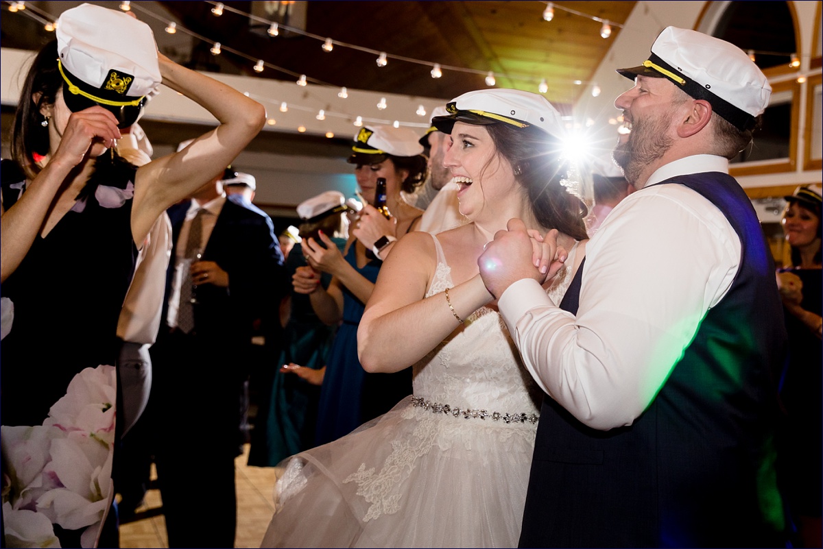 Spruce Point Inn Boothbay Harbor Maine Wedding yacht hats are brought out to the reception for even more fun times while dancing
