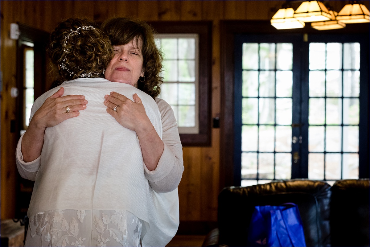Linekin Bay Resort Wedding Photographer in Boothbay Maine one quick hug from the mom before the bride heads out for her first look