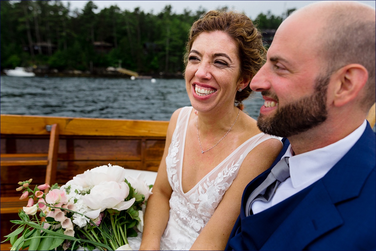 Linekin Bay Resort Wedding Photographer in Boothbay Maine the newlyweds are all smiles out on the Cris Craft boat ride