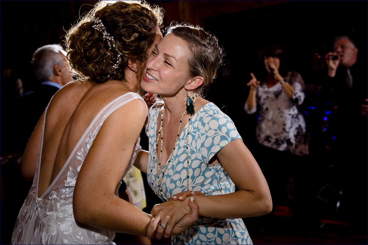 Linekin Bay Resort Wedding Photographer in Boothbay Maine guests enjoy dancing with the bride during the reception