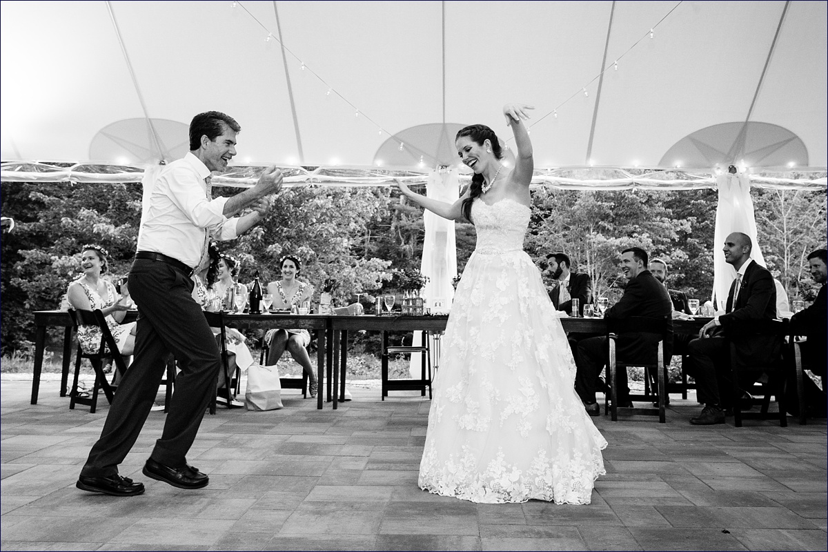 The bride dances with her dad at her wedding reception