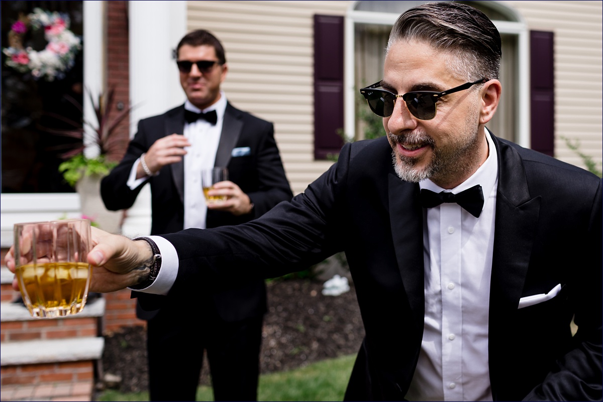 The groom shares a toast on his wedding day